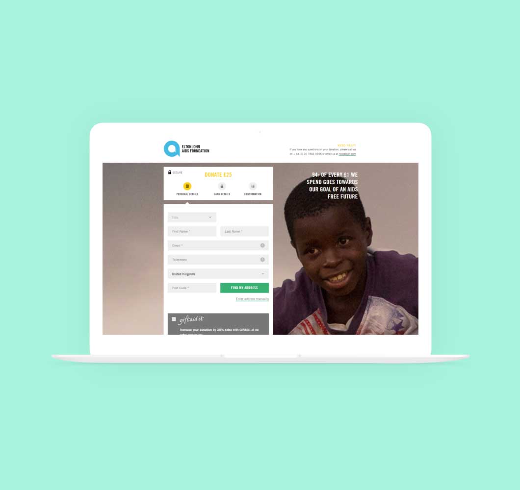 An example of the Elton John Aids Foundation donation checkout page displayed on a laptop sat on a green background.